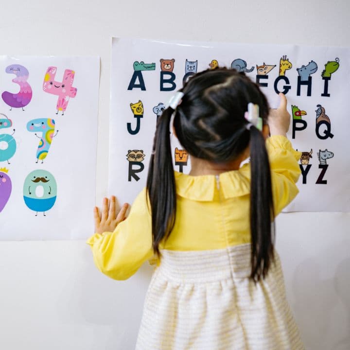 Little girl learning the alphabet at ABA therapy center